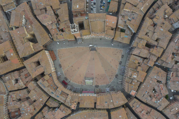 Piazza del Campo - Siena - Birds Eye View Birds eye view of Piazza del Campo at sunset - Tuscany - Italy torre del mangia stock pictures, royalty-free photos & images