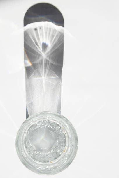 istock Crystal clear water in a water glass on white background 1038192230