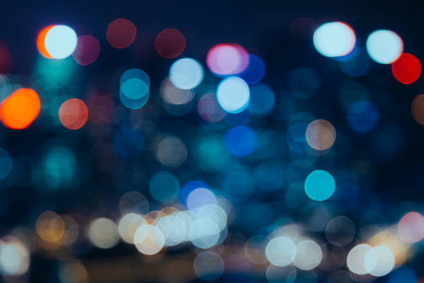 istock City lights bokeh blur effect at night. Unfocused blurred urban abstract background 1038198454