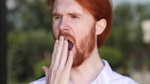 istock Yawning Tired Designer need Sleep 1038201852