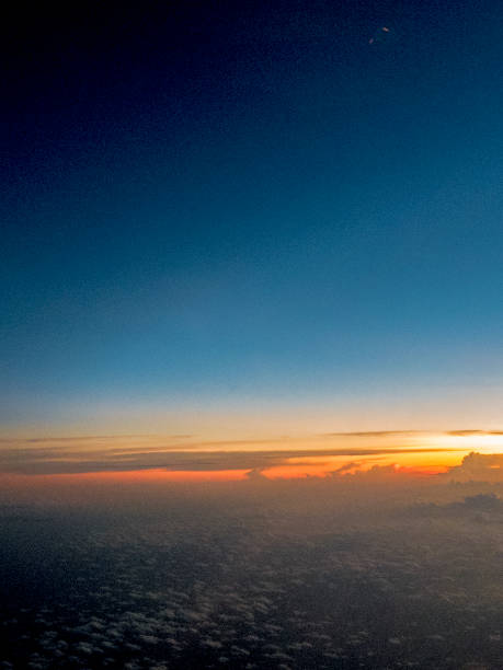 istock sunset horizon seen from an airplane window above indonesia 1038231952