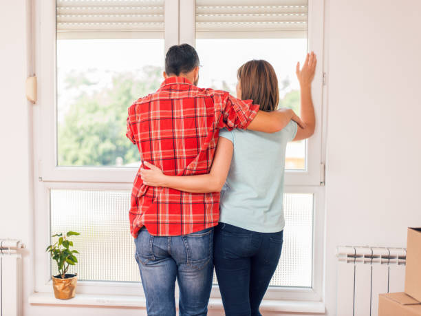 istock Happy couple in new home 1038234958
