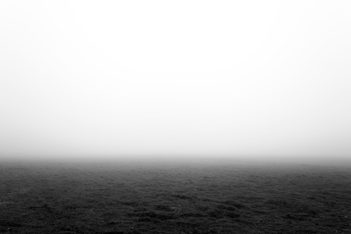 Cold mist descending over rural fields