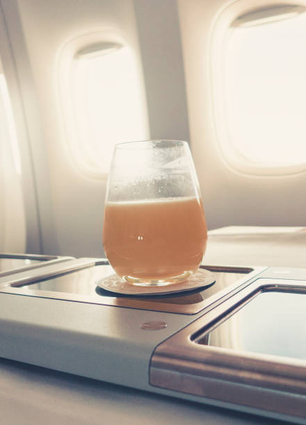 istock orange juice in business class flight, luxury travel 1038246384