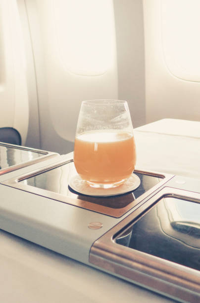 istock orange juice in business class flight, luxury travel 1038246422