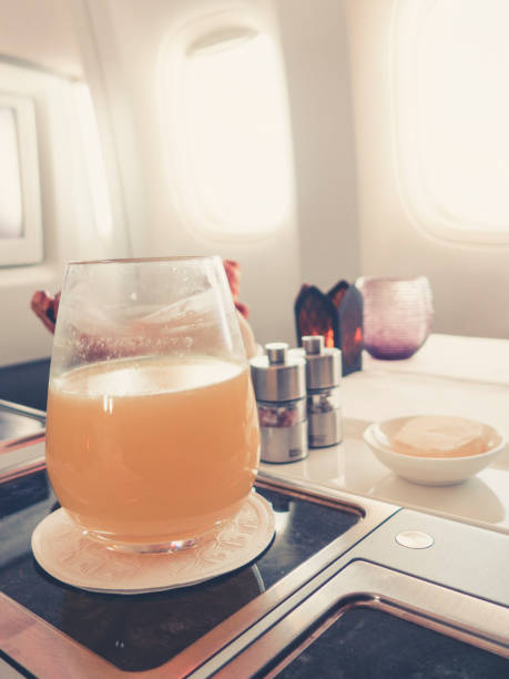 istock orange juice in business class flight, luxury travel 1038246594