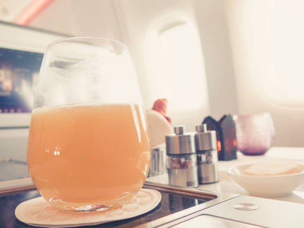 istock orange juice in business class flight, luxury travel 1038246638