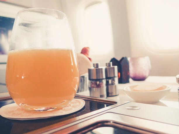 istock orange juice in business class flight, luxury travel 1038246640
