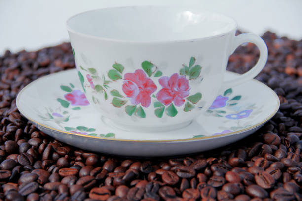 istock the flowered coffee cup is covered with coffee beans1 1038246756