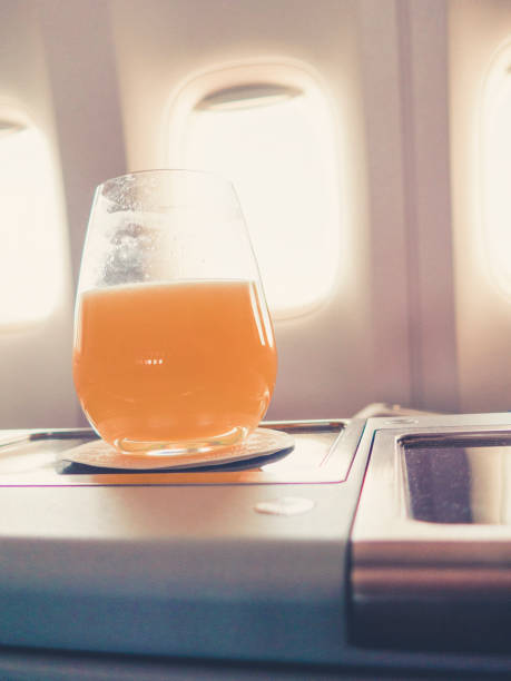 istock orange juice in business class flight, luxury travel 1038251640
