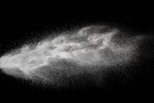 istock White talcum powder explosion splashing on black background. Use for web design or billboards abtract background. 1038253448