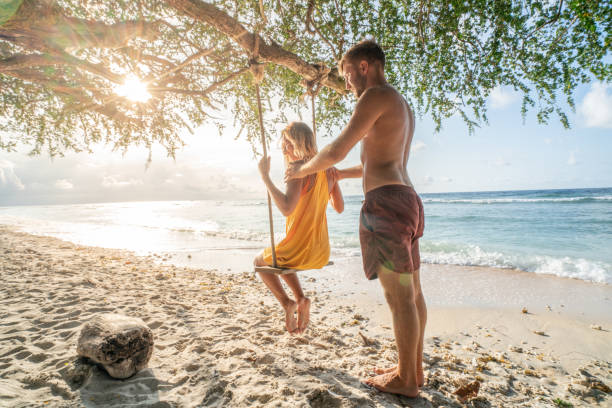 istock Young couple on sea swing, Bali, Indonesia 1038254366