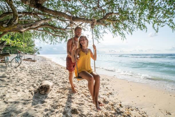istock Young couple on sea swing, Bali, Indonesia 1038256540