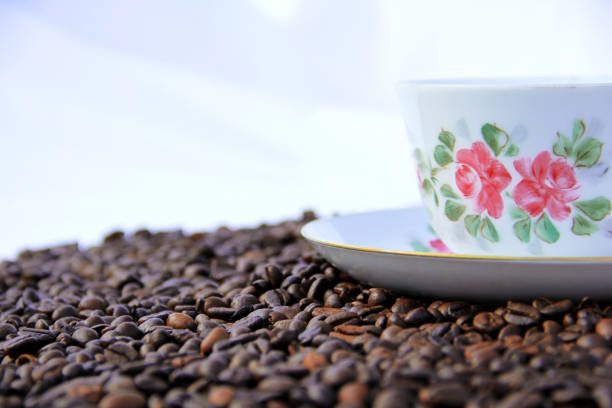 istock the flowered coffee cup is covered with coffee beans2 1038257916