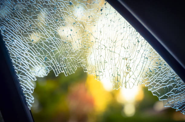 istock Outside broken window car smashed by thief for insurance concept 1038258104
