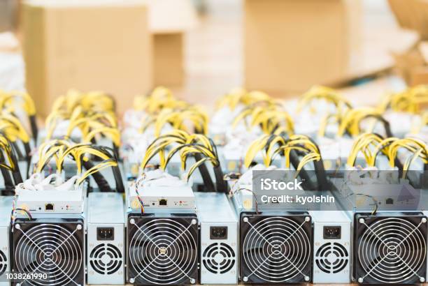 Rows Of Dedicated Asic For Cryptocurrency Mining Farm Bitcoin Ethereum And Other Altcoins Producing Rig Stock Photo - Download Image Now
