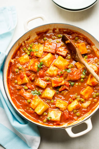 Matar paneer with with paneer cheese, peas and tomato sauce.