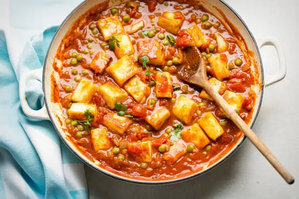 Photo of Matar paneer with with paneer cheese, peas and tomato sauce.