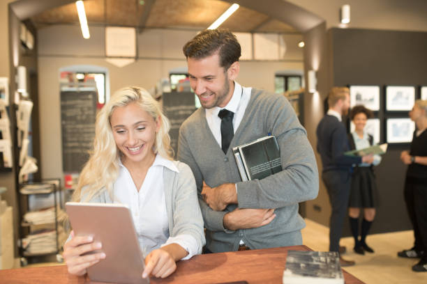 istock Happy young couple at public library 1038270076