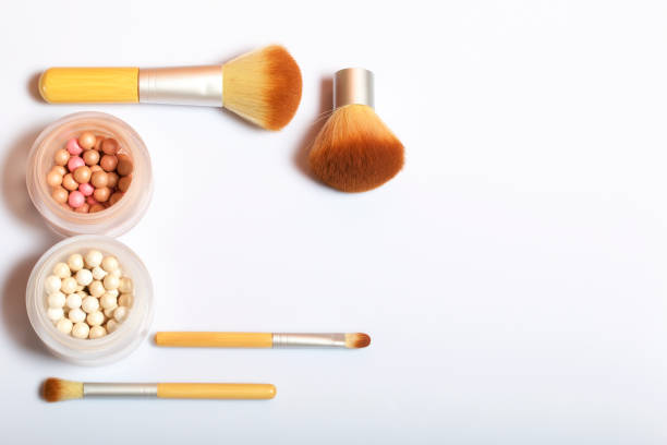 istock Brushes for applying makeup of different sizes and highlighter. 1038301594