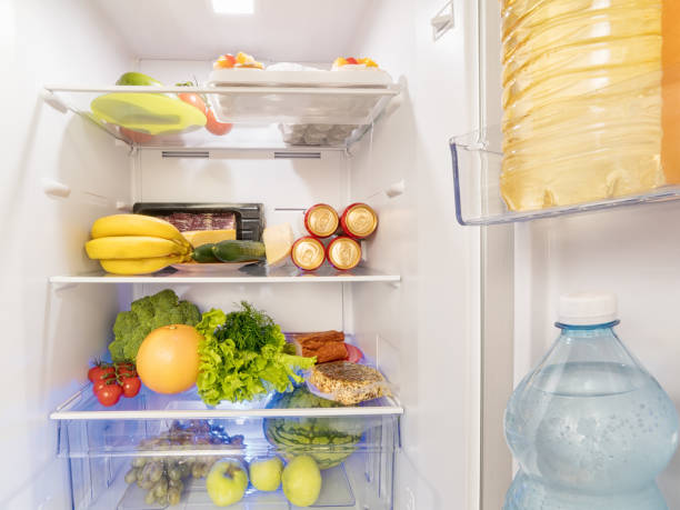 istock Fresh food and drink in the open fridge 1038301766