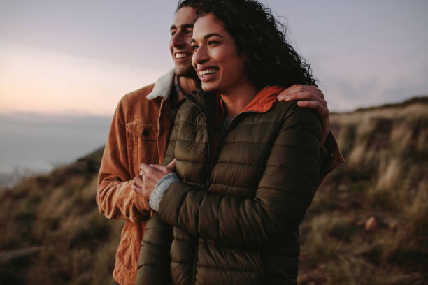 istock Loving couple looking at view and smiling 1038304432