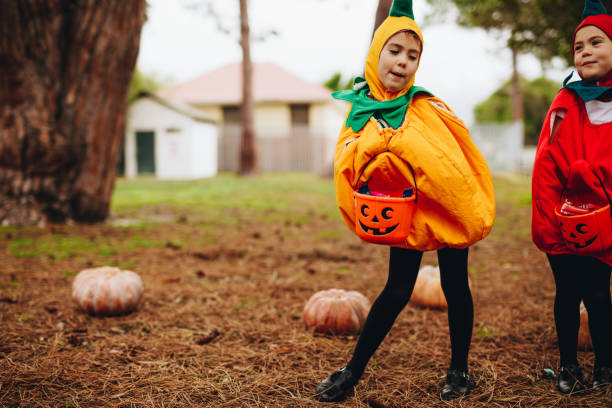 istock Identical twins ready for treat or tricking on halloween 1038308112