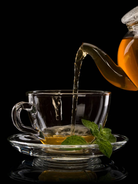 istock Cup filling by green tea 1038321534