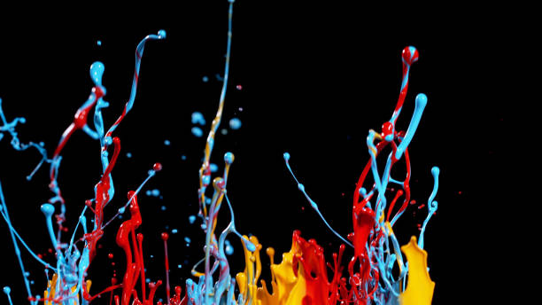 istock Abstract coloured paint splashes on black 1038322958