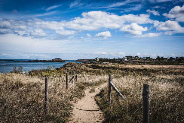 Walk on the Breton coast on a path in the middle of the dunes at the tip of the Varde.