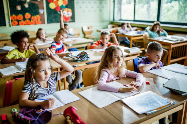 istock Large group of elementary students in the classroom. 1038331762