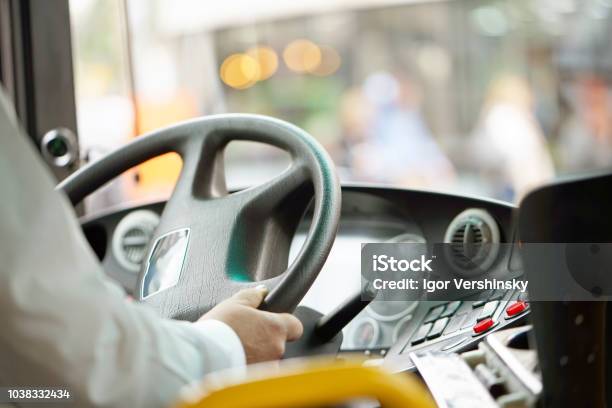 Cropped Shot Of Bus Driver Holding Steering Whee Stock Photo - Download Image Now - Bus, Bus Driver, Driving