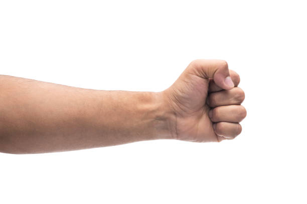 istock Males hand with a clenched fist isolated on white background 1038336232