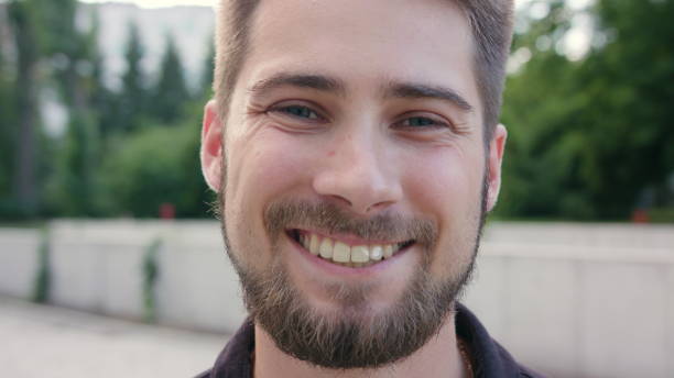 istock Happy Smiling Man with Beard in Town 1038339432