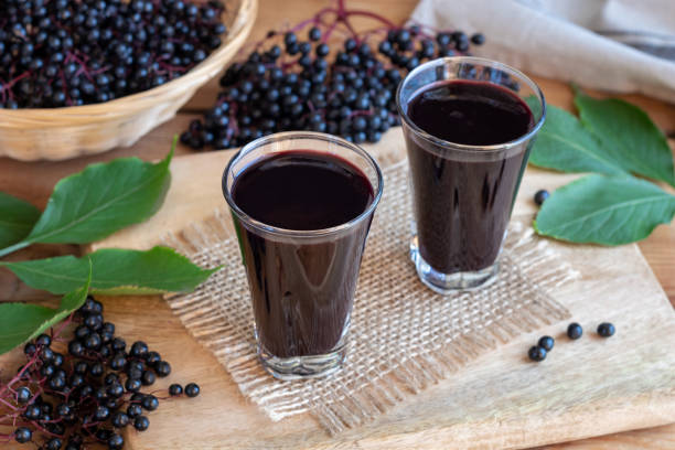 istock Black elder syrup, berries and leaves 1038339930