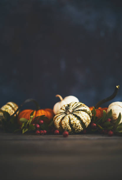 istock Artistic still life fall background with rustic wood and pumpkins 1038344588