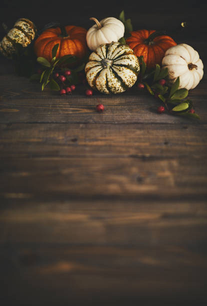 istock Artistic still life fall background with rustic wood and pumpkins 1038349778