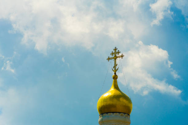 istock Dome with a cross on the Church against the sky. 1038355294