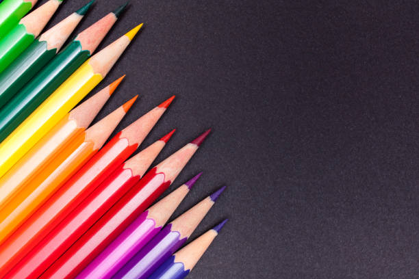istock Color pencils on a black background 1038367354