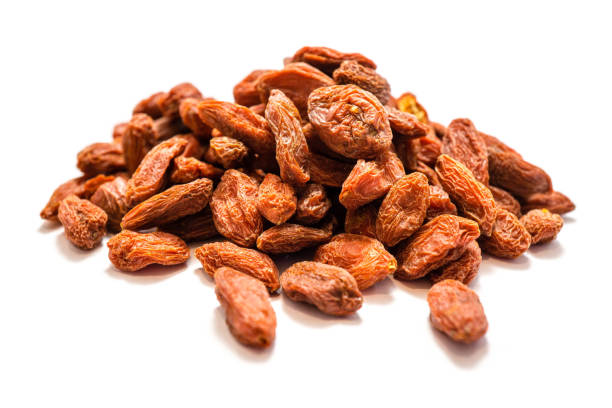 istock Piles of goji berries isolated on a white background 1038369026