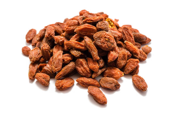 istock Piles of goji berries isolated on a white background 1038369030