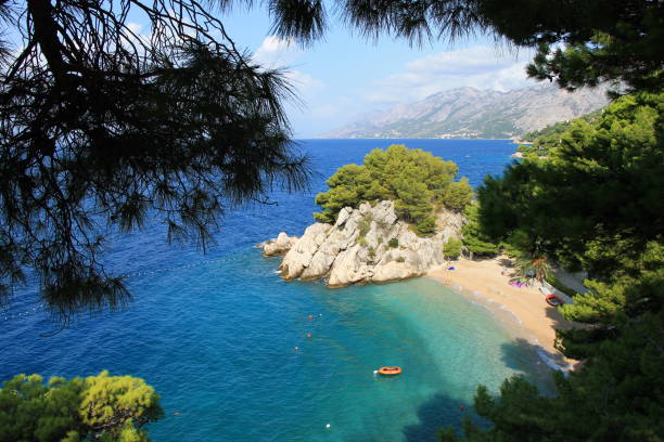 istock Beautiful beach in small mediterranean town Brela , Croatia 1038373448