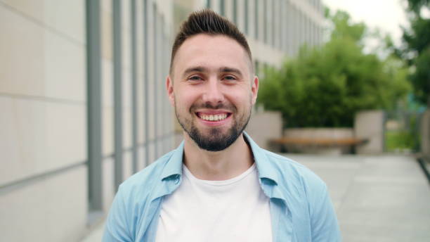 istock Man with Beard Smiling in the City Street 1038377582