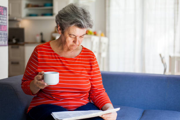 istock senior woman drinking coffee 1038382946