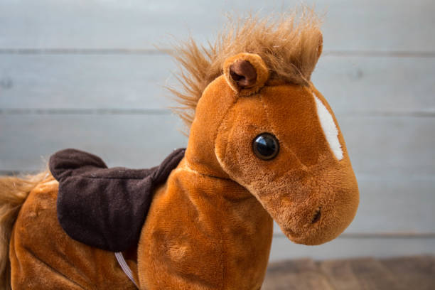 istock beautiful red horse with a saddle kid toy 1038385874