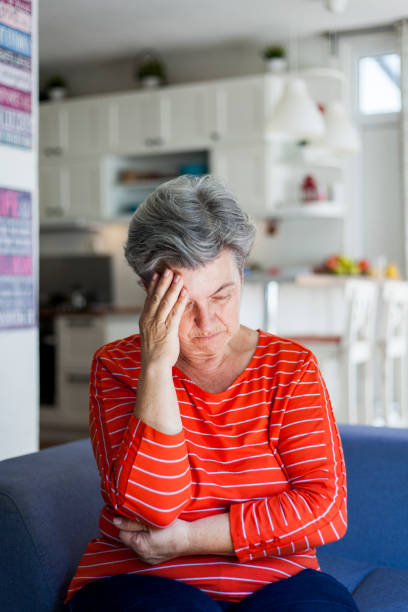 istock depressed senior woman 1038389654