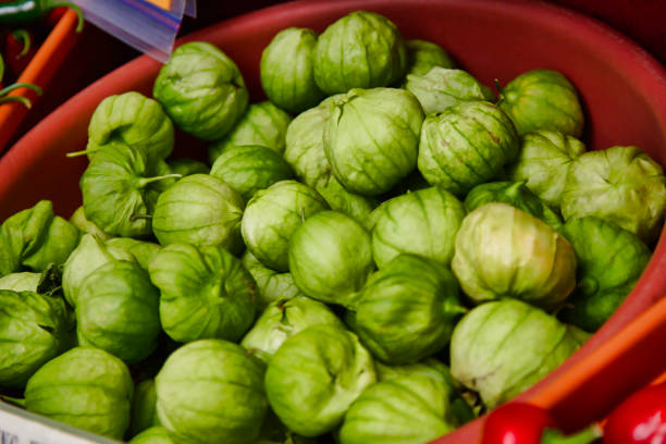 a large pile of Farmer's market tomatillos