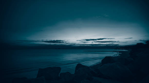 Blue Sunset (Duotono) on the coast of Colonia del Sacramento, Uruguay. stock photo