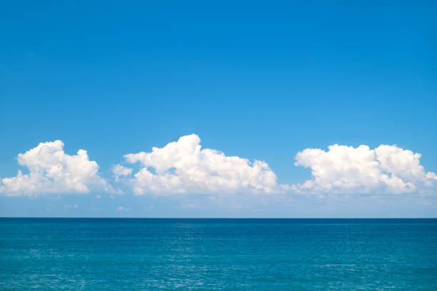 istock blue sea and cloudy sky over it 1038411214