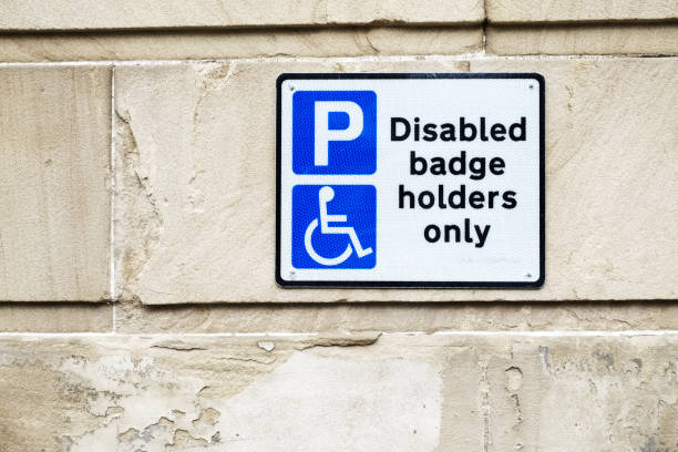istock Disabled Badge Holders Only at Car Park Sign on Wall 1038442144